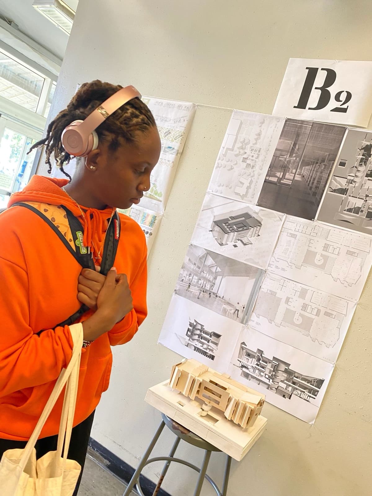 A scholar presenting their research exhibit