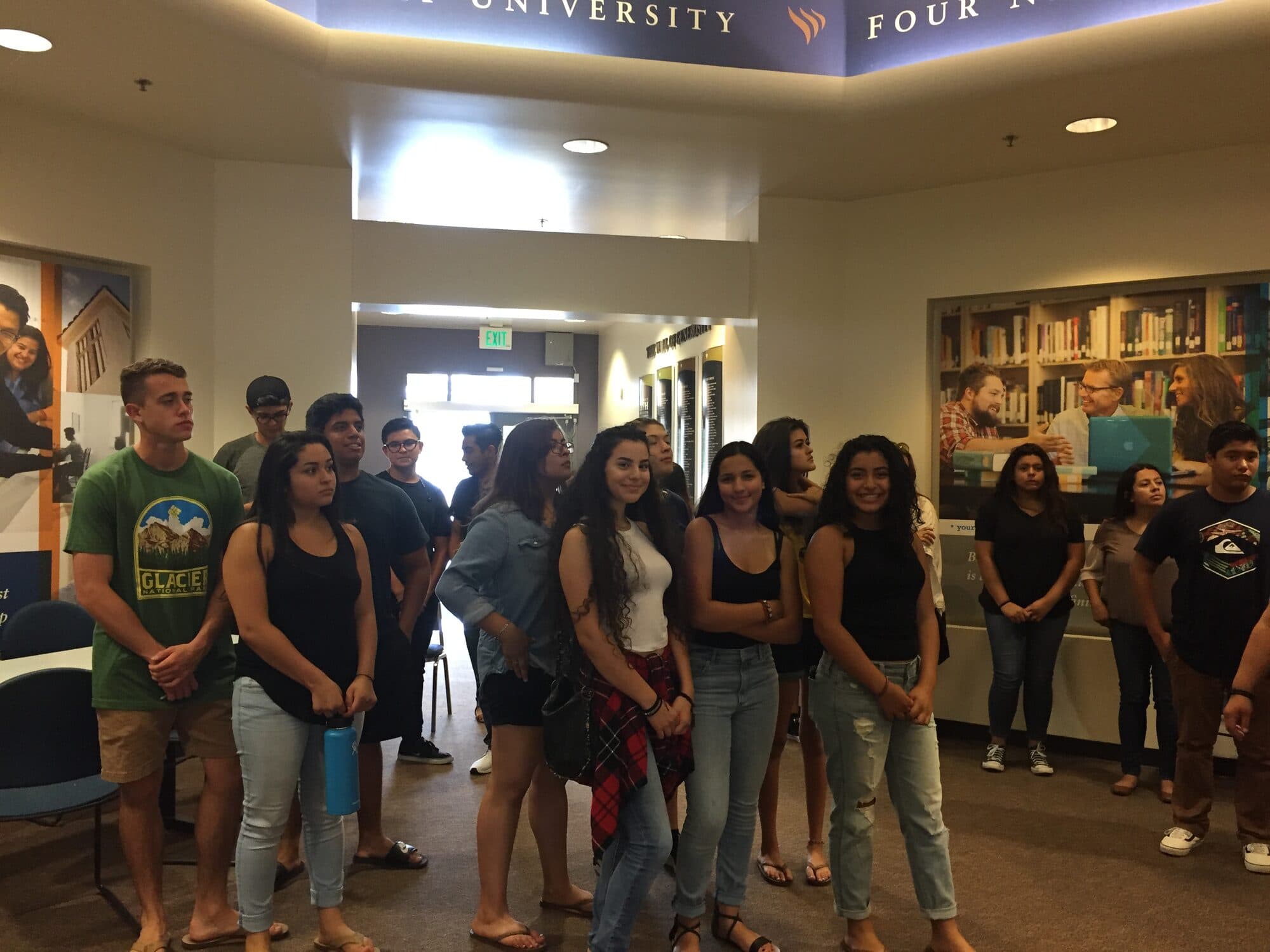 Scholars standing together inside a university building